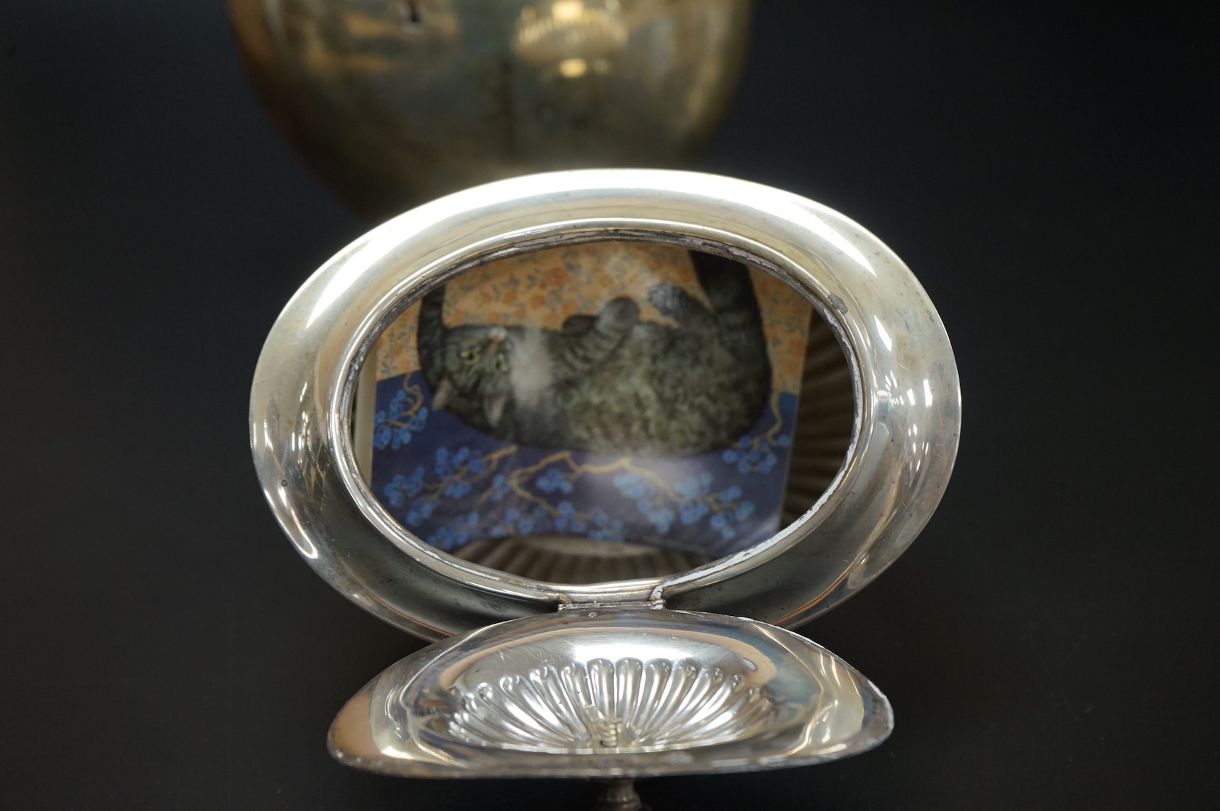A late Victorian demi-fluted oval tea caddy, by William Hutton & Sons, London, 1894, width 11.1cm, together with a 19th century continental white metal oval tea caddy, possibly French, no key.